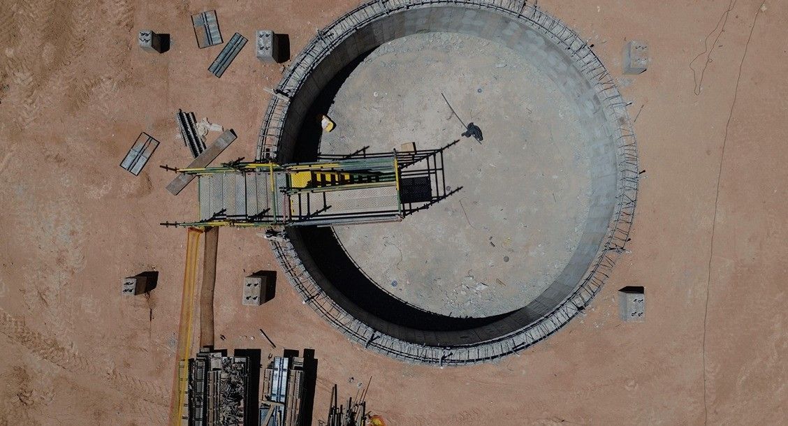 An aerial view of a circular concrete structure under construction