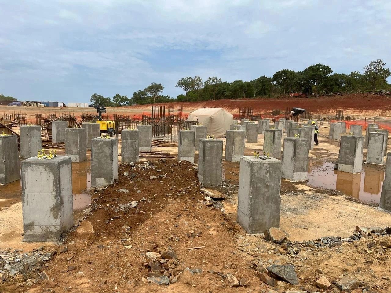 Rows of concrete plinths on a plant construction site