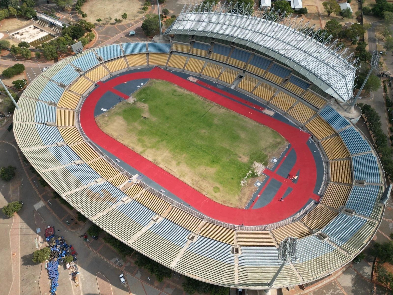 An aerial view of a stadium with a running track