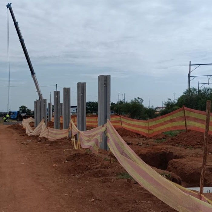 Concrete wall posts along a foundation trench
