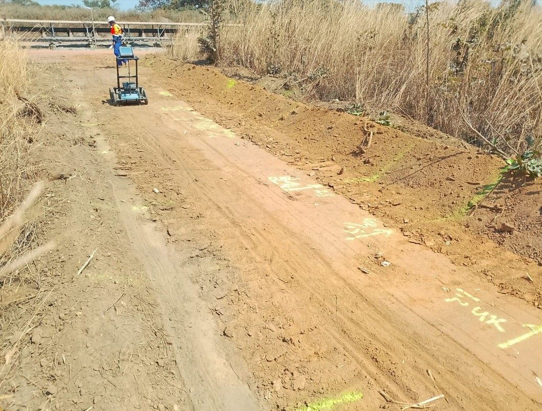 Utility detection equipment on a dirt road on site